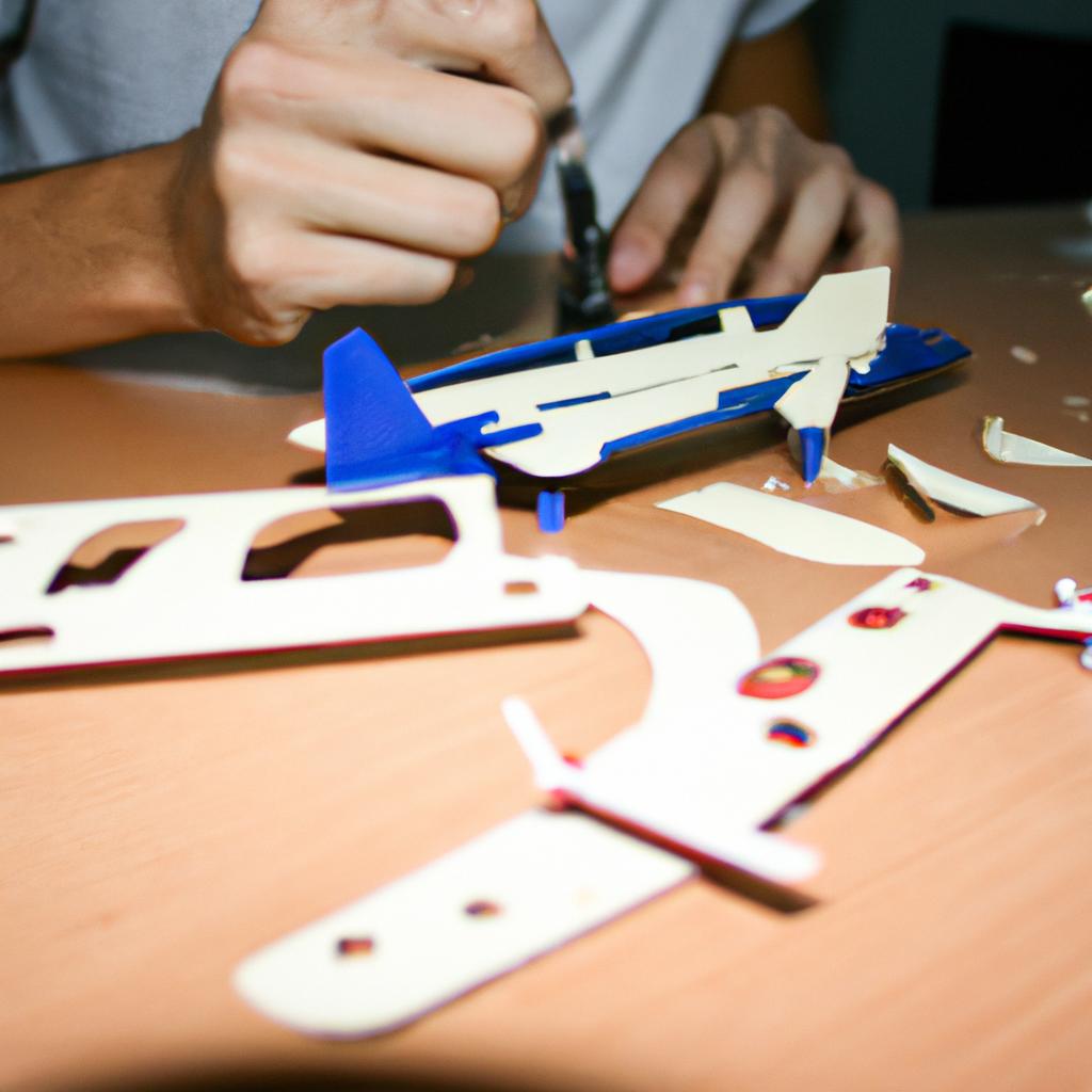 Person assembling RC plane components